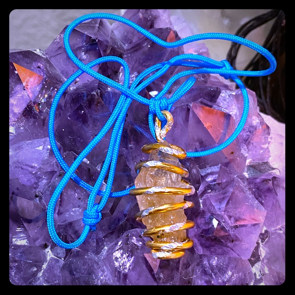 NATURAL RUTILATED CRYSTAL HANDWRAPPED IN GOLD WIRE